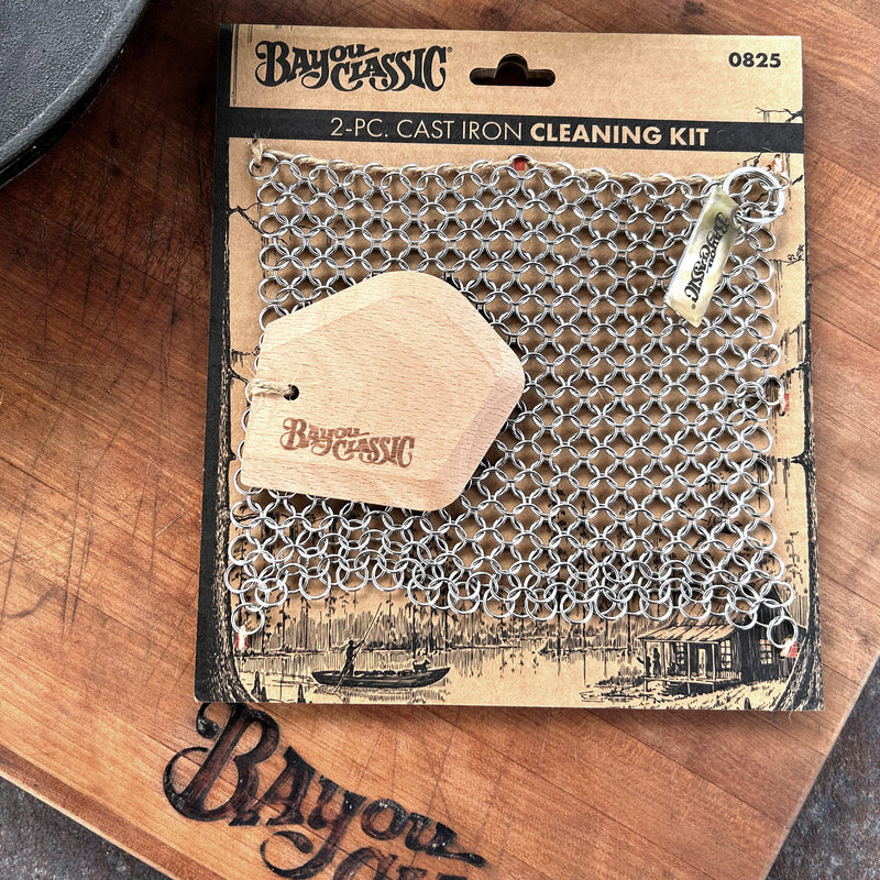Cast Iron Cleaning Kit showing chainmail scrubber and beech wood scraper in packaging