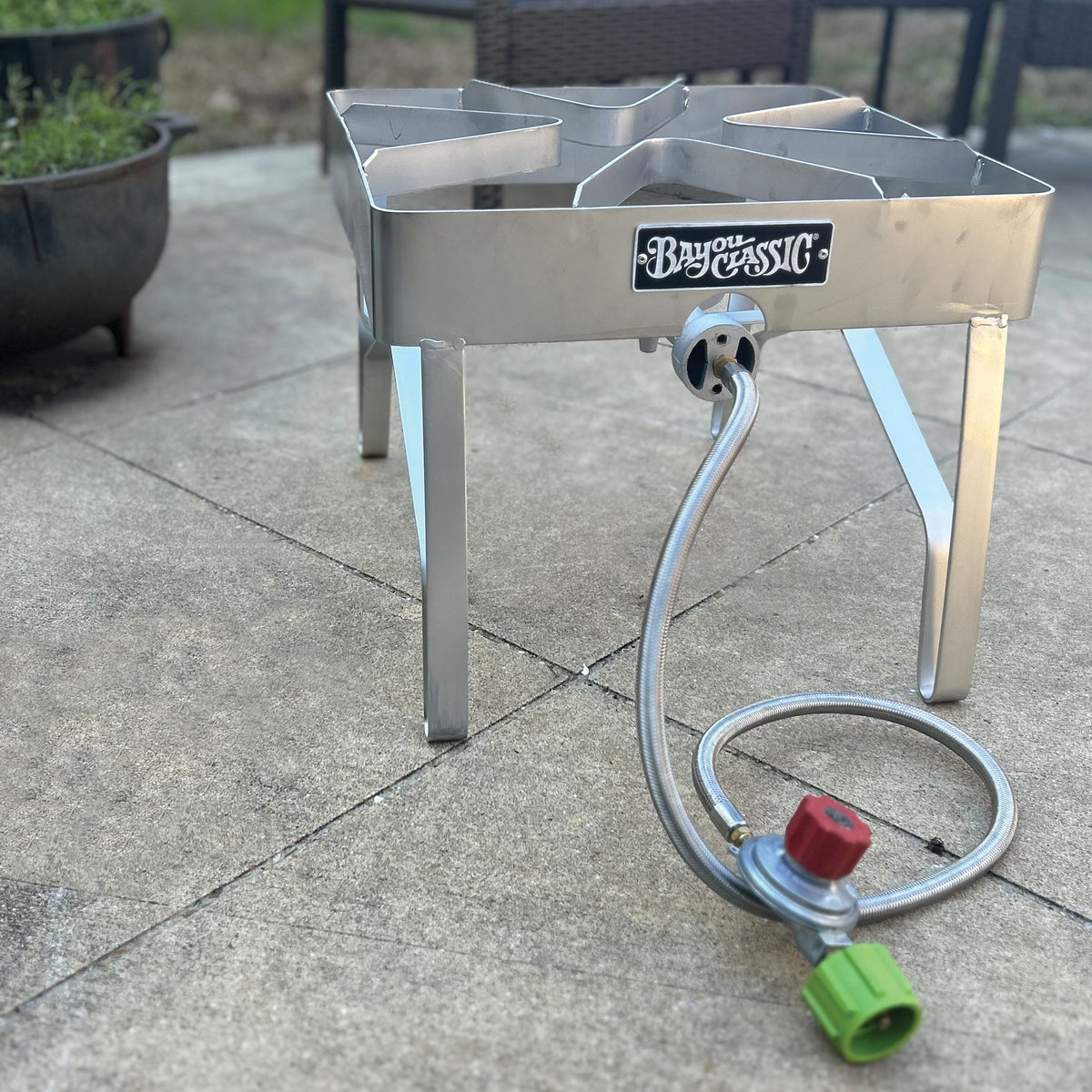 Stainless outdoor cooker on a patio setting