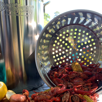 Stainless Stockpot with Basket dumping crawfish on an outdoor table