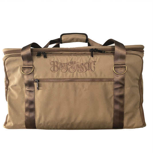 A brown Sportsmans Gear Bag with brown straps and antique brass D-rings, featuring the Bayou Classic logo on a white background