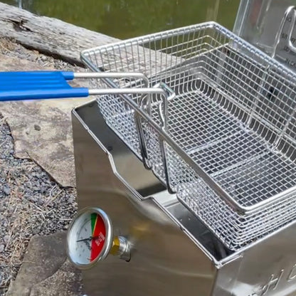 Close up of 2.5-gal Stainless Bayou Fryer Basket next to a body of water