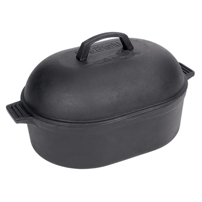 A black cast iron oval roaster with a domed lid and side handles on a white background