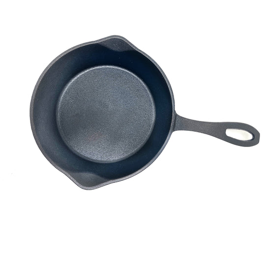 Overview of 8-in cast iron skillet on a white background