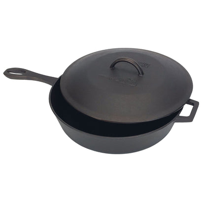 A black 5-qt cast iron covered skillet with a dome-shaped lid on a white background