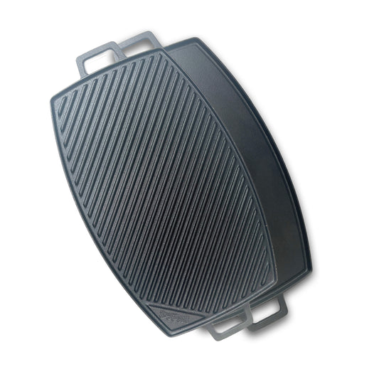 Rectangle cast iron griddle showing ribbed side and flat side on a white background