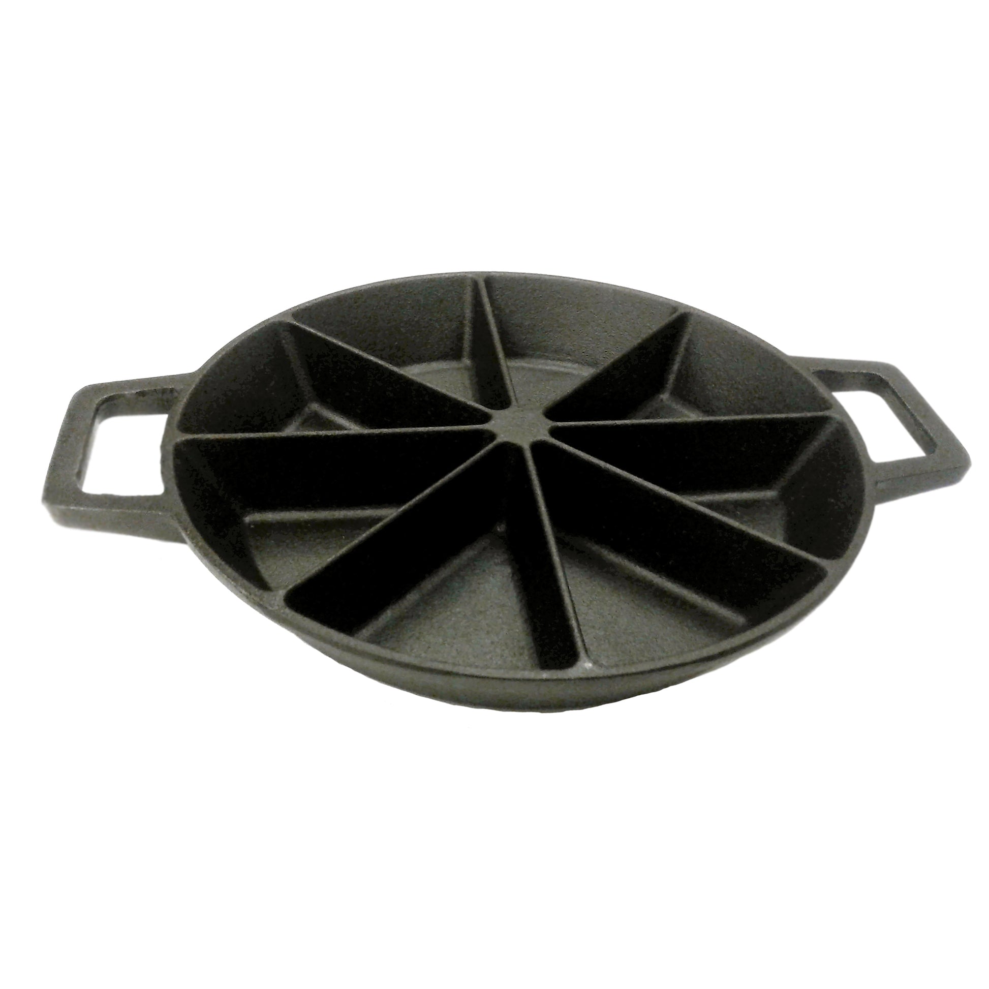 A black cast iron wedge cornbread skillet with side loop handles on a white background