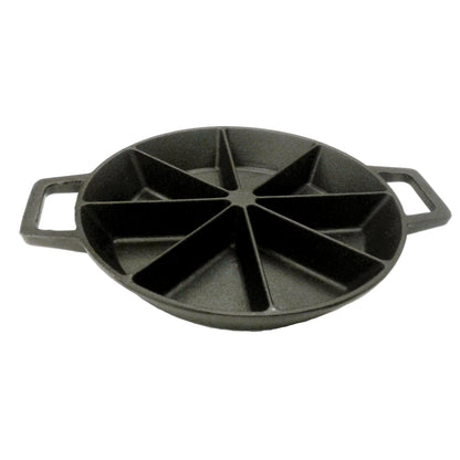 A black cast iron wedge cornbread skillet with side loop handles on a white background
