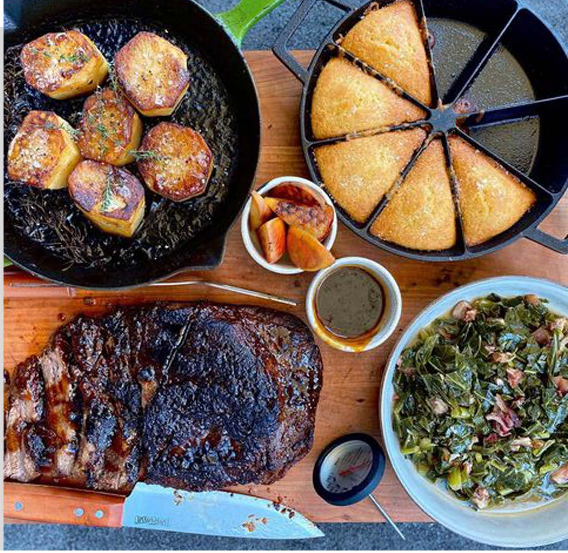 Cast Iron Wedge Pan with cornbread next to brisket and turnip greens