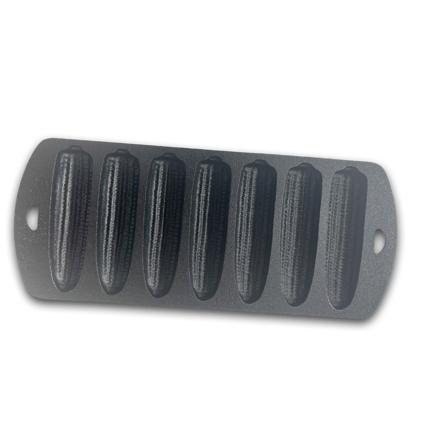 Cast iron cornbread pan with seven cornstick molds on a white background.