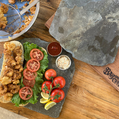 Open faced fried shrimp poboy with fresh ingredients