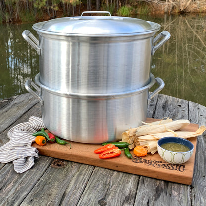 Aluminum steamer with ingredients to make tamales in an outdoor setting